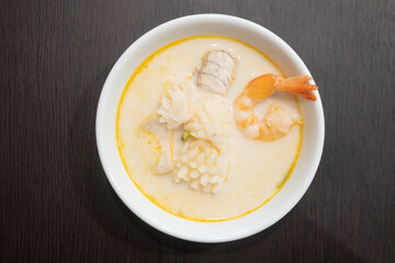 Curry in coconut milk with shrimp, squid and fish