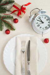 Christmas table setting on the beige tablecloth. Top view. Close-up.