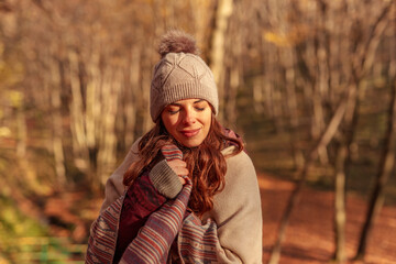Woman relaxing outdoors on sunny autumn day