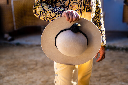 Crop bullfighter in golden traditional costume
