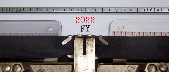 2022 FY fiscal New Year symbol. Words '2022 FY fiscal year' typed on retro typewriter. Business and...
