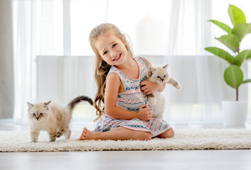 Girl with ragdoll kitten