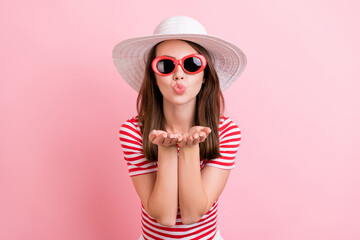 Photo of young attractive girl pouted lips send air kiss sunhat summer isolated over pink color background