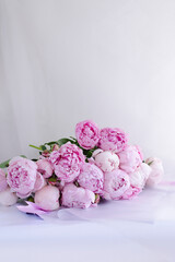 Bouquet of pink peonies. In China, the peony is an imperial flower, a symbol of nobility and wealth. Close-up, copy space, background, selective focus.