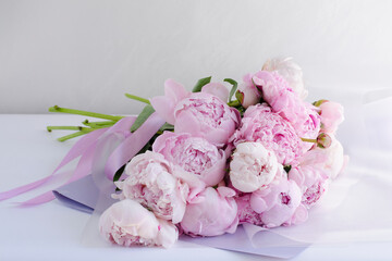 Bouquet of pink peonies. In China, the peony is an imperial flower, a symbol of nobility and wealth. Close-up, copy space, background, selective focus.