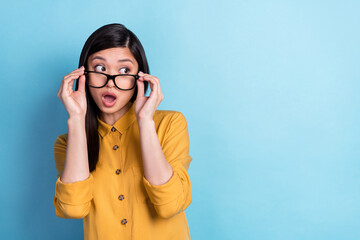 Photo of young asian girl amazed shock fake novelty rumor hands touch eyeglasses look empty space...