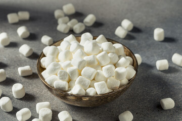 Fototapeta na wymiar Unhealthy Sugary White Mini Marshmallows