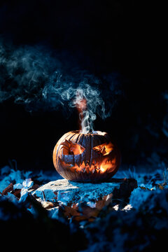 Close-up of a pumpkin on a dark background prepared to celebrate Halloween