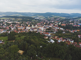 Fototapeta na wymiar Center of small village with hills in neighborhood