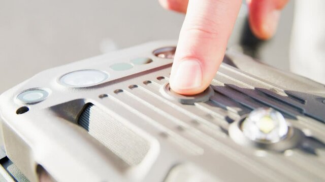 preparing a big drone RTK for flying over a roof to measure its size, changing Batteries, unfold the wings, camera 