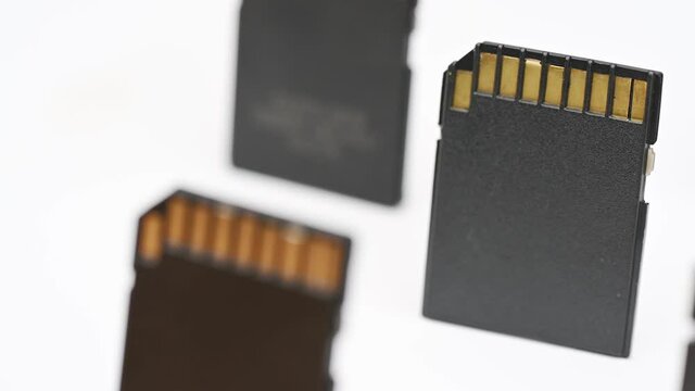 clips video 4k and full HD of memory SD card isolated on clean background this sd card for various computer, digital camera and smart mobile phone devices.