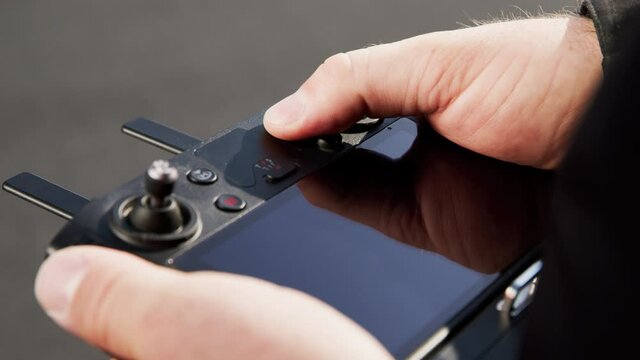 preparing a big drone RTK for flying over a roof to measure its size, changing Batteries, unfold the wings, camera 