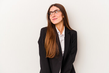 Obraz premium Young caucasian business woman isolated on white background dreaming of achieving goals and purposes