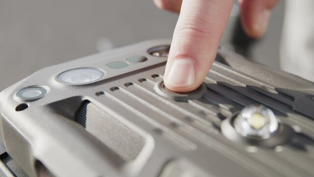 preparing a big drone RTK for flying over a roof to measure its size, changing Batteries, unfold the wings, camera 