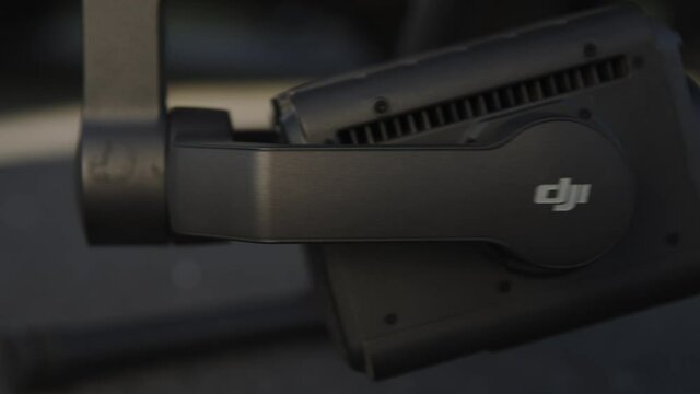 preparing a big drone RTK for flying over a roof to measure its size, changing Batteries, unfold the wings, camera 