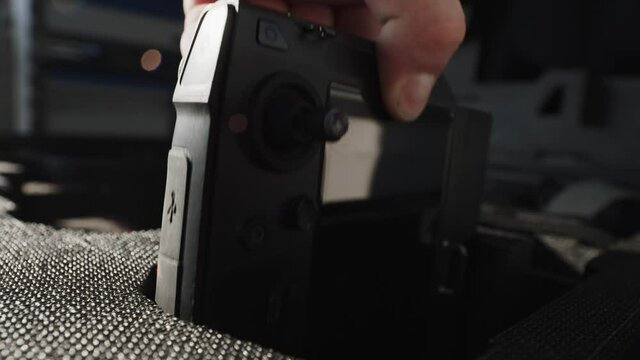 preparing a big drone RTK for flying over a roof to measure its size, changing Batteries, unfold the wings, camera 