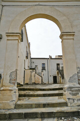 The facade of an old house in the historic center of Aliano, a medieval town in the Basilicata region, Italy.