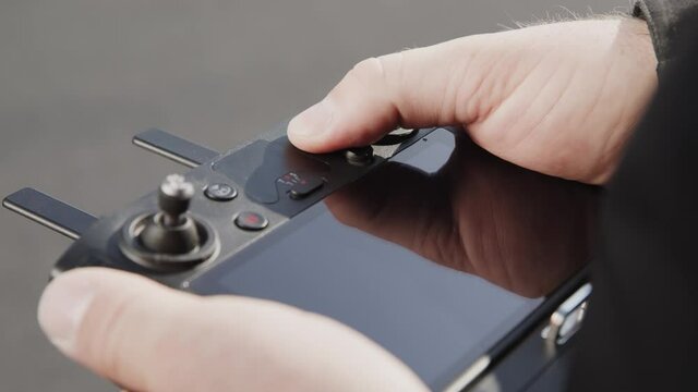 preparing a big drone RTK for flying over a roof to measure its size, changing Batteries, unfold the wings, camera 