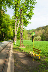 Tram stop in the countryside with bench