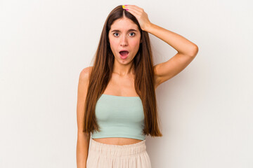 Young caucasian woman isolated on white background being shocked, she has remembered important...