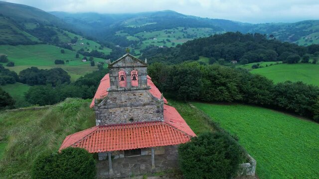 Aerial view from a drone of the hermitage of San Vicente, between Esles and Lloreda in the municipality of Santa Mar&iacute;a de Cayon in the Valles Pasiegos. Cantabria, Spain, Europe