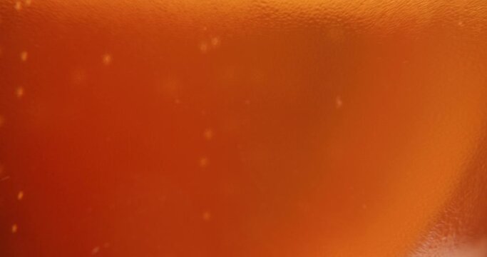 Close up filling up a glass of beer