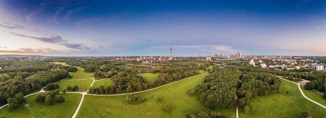 Drone panorama over Frankfurt skyline in evening light taken from Niddapark