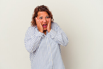 Middle age latin woman isolated on white background scared and afraid.