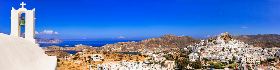 Picturesque authentic Ios island. View of scenic old town Chora with whitewashed houses and...