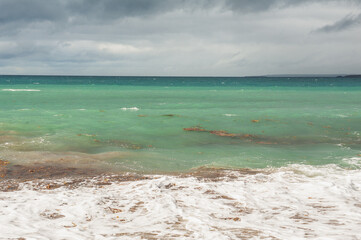 Sea waves in storm and dramatic clouds