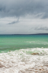 Sea waves in storm and dramatic clouds