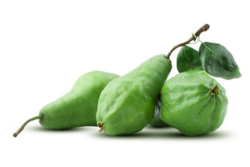 Three ripe green pears with a twig and a leaf lie on a white background, with a shadow