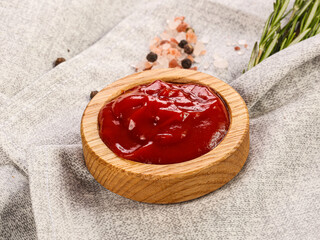 Tomato sauce in the wooden bowl