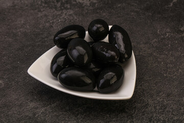 Pickled black olives in the bowl