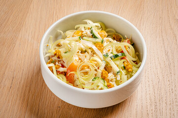 cabbage salad in the white bowl