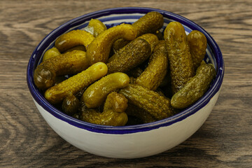 Pickled gherkin in the bowl