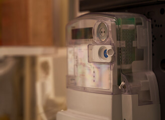 Close up of a smart digital energy meter in the meter cupboard