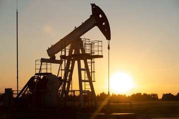 Oil Pump on orange sunset.