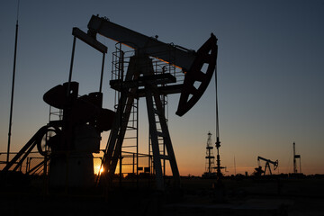 Oil Pump on orange sunset.