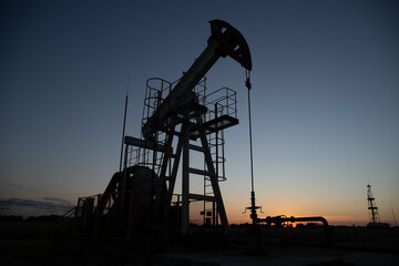 Oil Pump on orange sunset.