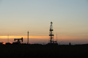 Oil Pump on orange sunset.