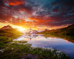 Wonderful summer view of the Bachalpsee lake and rocky massif. Grindelwald valley, Switzerland, Europe.