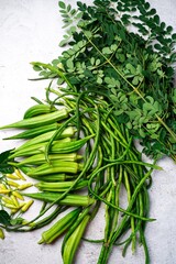 Fototapeta premium Fresh picked garden vegetables - long beans,Moringa leaves okra