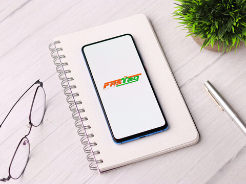 Assam, india - March 10, 2021 : FASTag logo on phone screen stock image.