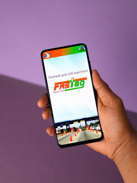 Assam, india - March 10, 2021 : FASTag logo on phone screen stock image.