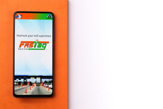 Assam, india - March 10, 2021 : FASTag logo on phone screen stock image.