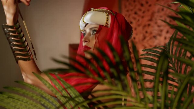 sexy concubine in turkish harem is dancing sexually and flirting, exotic dancer portrait