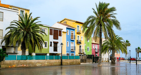Fototapeta premium Villajoyosa village, Spain - beautiful colorful houses and palm trees after rain. Popular Spanish tourist destination in Costa Blanca region on Mediterranean sea
