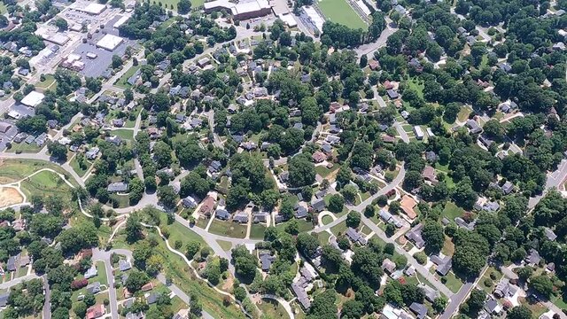 Bird eye view of houses and trees in city during sunny day, Burlington, North Carolina, USA