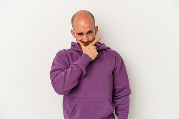 Young bald man isolated on white background contemplating, planning a strategy, thinking about the way of a business.